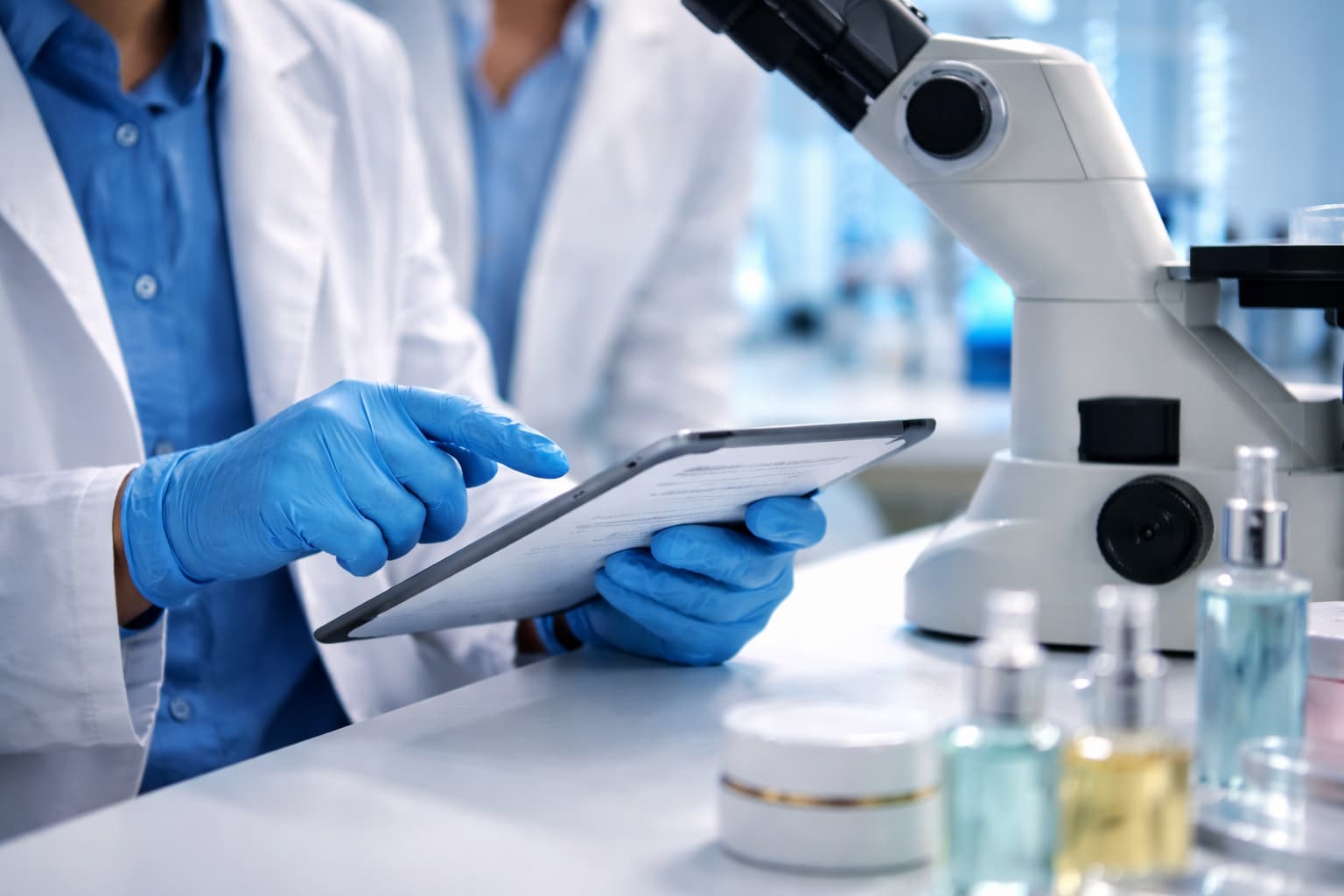 CPNP notification in the Cosmetic Products Notification Portal β lab technician entering cosmetic product data on a tablet next to a microscope and skincare products