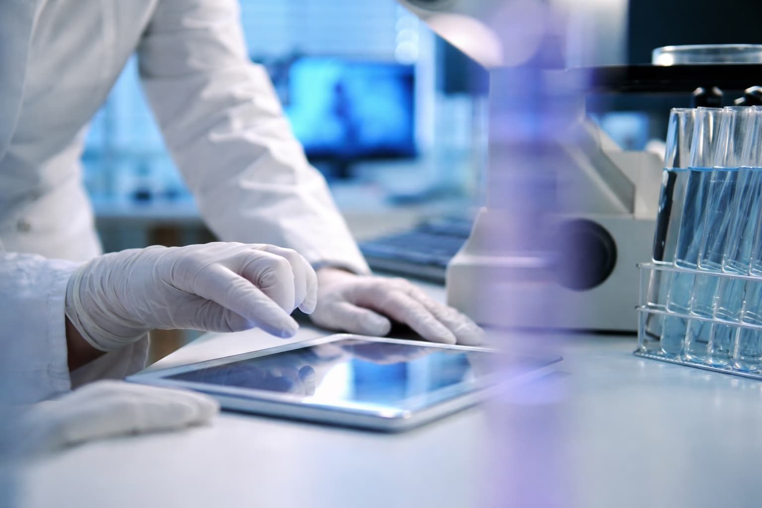 Digital Batch Record capture in a cosmetics laboratory β lab technician documents GMP-compliant manufacturing data on a tablet next to test tubes
